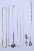 A silver mounted Wedgwood pendant on a silver chain, a single strand pearl necklace,