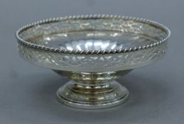 A pierced silver bonbon dish. 11 cm diameter. 79.9 grammes.