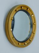 A late 19th/early 20th century gilt-framed convex wall glass. 26.5 cm diameter.