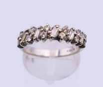 An 18 ct white gold and diamond ring. Ring size N/O.