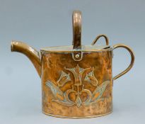 An Art Nouveau copper watering can. 22 cm high.