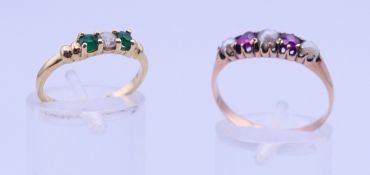 An unmarked gold pearl and ruby ring, and a 9 ct gold dress ring. 3.8 grammes total weight.