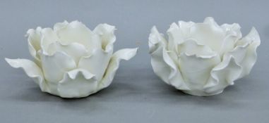 A pair of cream ceramic lotus flower-form candle holders. Each 7 cm high.