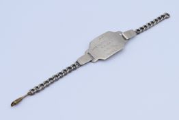 A WWII Polish military ID bracelet inscribed A P WOLOSZYN .JAN RZ. KAT R.1915 N:10 / III.
