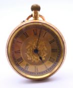 An 18 K gold fob watch. 3.75 cm diameter. 36.5 grammes total weight.