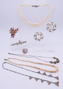 A small quantity of costume jewellery, including two pearl necklaces, brooches, a hairclip,