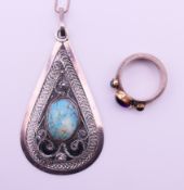 A silver ring and a silver pendant on a silver chain. Pendant 6.5 cm high. Ring size N.