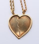 An unmarked 9 ct gold split heart pendant in two parts and two 9 ct gold chains.