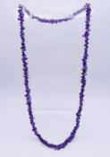 An amethyst necklace. 88 cm long.
