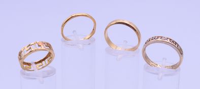 Three 9 ct gold wedding bands. 7.9 grammes, and a 22 ct gold wedding band. 2.4 grammes.