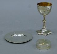 A silver three-piece Communion set and a silver-mounted oyster shell. The chalice 10 cm high.