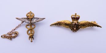 a 9ct gold RAF military sweetheart brooch and another sweetheart brooch. 4 cm wide and 2.5 cm high.