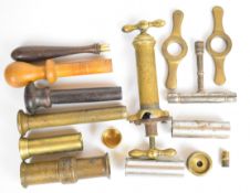 A collection of mainly 10 and 12 bore gun and reloading tools including T-shaped nipple key,