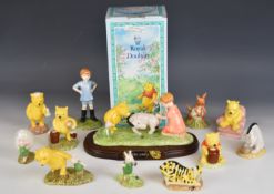 Twelve Royal Doulton Walt Disney Winnie the Pooh figures including Eeyore Loses a Tail tableaux
