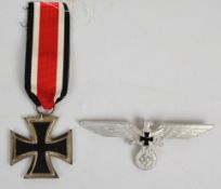 German WW2 Nazi Third Reich Iron Cross together with a metal eagle badge