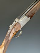 Browning B25 C3 12 bore over and under ejector shotgun with scrolling engraving to the locks,