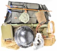 A collection of militaria including machine gun cleaning kit in canvas bag, spare barrel case,