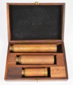 Graduated set of three brass telescopes, in wooden box, maximum length of longest telescope 45cm
