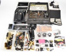 A collection of shotgun and rifle accessories including Boss, Purdey and similar snapcaps, Simmons