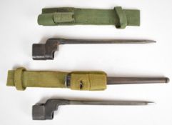 Two British number 4 Mk 2 spike bayonets with 20cm blades and frogs together with one scabbard.