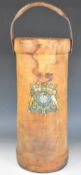 Ammunition / cordite leather covered canvas carrier with coat of arms and leather carry strap,