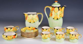 Grays Pottery Art Deco coffee set decorated with bright yellow flowers against a green ground, the