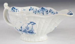 First period Worcester porcelain blue and white relief moulded pedestal sauce boat decorated in