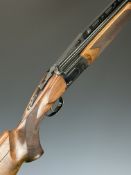 Antonio Zoli Kronos 12 bore over and under ejector shotgun with gold named locks and underside,