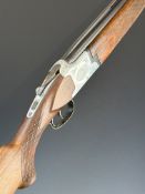 Laurona 12 bore over and under shotgun with engraved lock, underside, trigger guard and thumb lever,