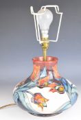 Moorcroft pedestal ship's decanter shaped table lamp decorated in the Tulip pattern, signed to base,