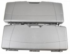 Two Megaline shotgun or rifle flight or carry cases with padded interiors, each 98x38x15cm.