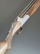 Lanber 12 bore over and under shotgun with engraved locks, underside, trigger guard and thumb lever,