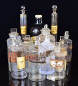 Fifteen vintage apothecary / medicine / chemist jars with stoppers, most with Latin script,
