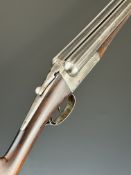 Frank Dyke & Co of London 12 bore side by side shotgun with chequered forend, slide thumb safety,