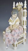 Lladro child figure Second Thoughts, seated girl with flowers, H27cm