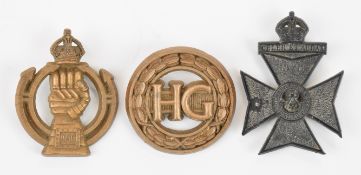Three British WW2 Economy badges comprising Home Guard and Royal Armoured Corps both by A. Stanley &