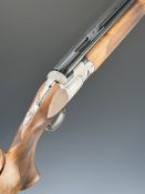 Beretta DT11 ACS 12 bore over and under ejector shotgun with named locks and underside, chequered