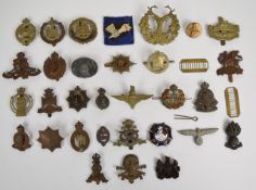 Small collection of mainly British Army cap badges including Royal Armoured Corps, The Buffs,