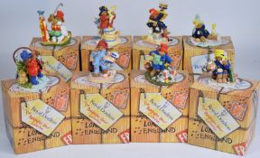 Eight Royal Doulton boxed Paddington Bear figures including Fishing, Baking A Cake, Golfer,