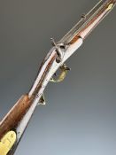 Brunswick percussion hammer action gun with engraved lion to the lock, brass trigger guard,