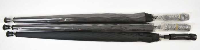 Three shooting stick umbrellas with LED torch to the handle, all unused in original packaging.