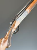 Valmet 12 bore over and under shotgun with engraved locks and underside, chequered semi-pistol