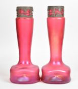 A pair of Loetz iridescent pink glass vases of rounded and dimpled square form with elongated