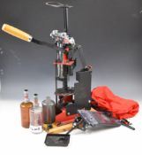 MEC 9000 Series shotgun cartridge re-loading press with cover and accessories.
