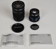 Two Olympus M.Zuiko digital camera lenses comprising ED 40-150mm f4-5.6 R and 45mm 1:1.8 to suit