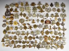 Approximately one hundred and forty military badges including Fife & Forfar Yeomanry, Liverpool