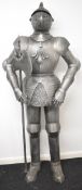 Replica suit of armour holding a battleaxe, H201cm. PLEASE NOTE: WE ARE NOT ABLE TO OFFER OUR