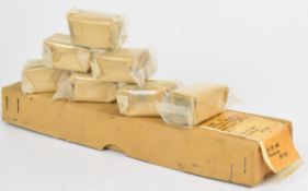 Seven Lee-Enfield No.4 foresight protectors in original packaging and delivery box.