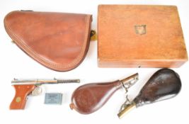 A collection of gun and shooting related items comprising Centre Point 4x32 scope, two leather
