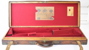 Stephen Grant & Sons brass and leather bound oak double shotgun carry case with fitted interior, 'By
